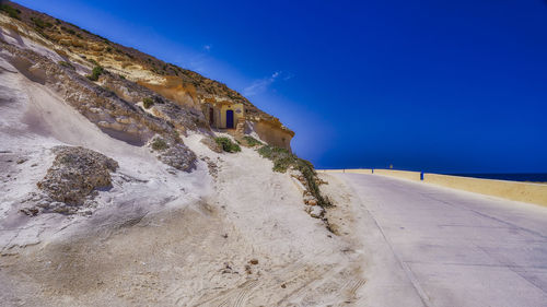 Scenic view of sea against blue sky