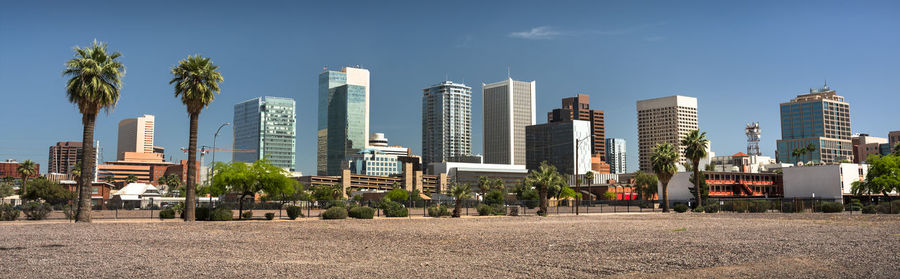 Panoramic view of city buildings against sky