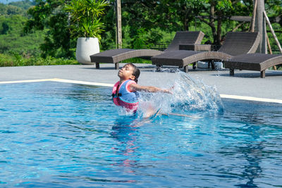 Man swimming in pool