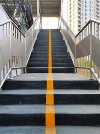 Low angle view of empty staircase against building