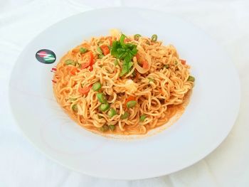 High angle view of noodles in plate on table