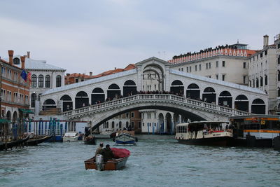 People on boat in canal