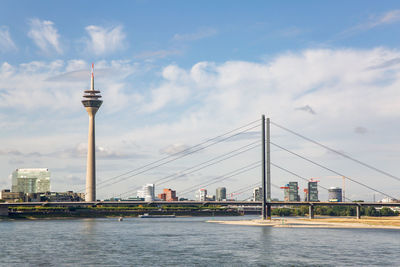 Bridge over river with buildings in background