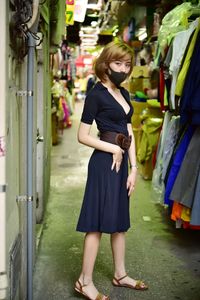 Full length portrait of girl standing outdoors