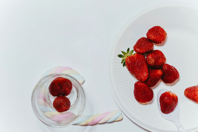 High angle view of strawberries in plate on table