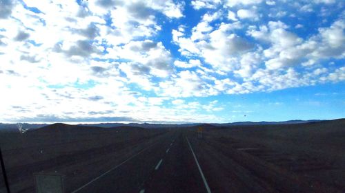 View of landscape against cloudy sky