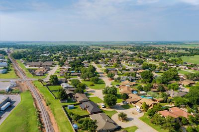 High angle view of buildings in city against sky