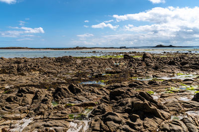 Scenic view of rocky beach in the island of batz a sunny day of summer