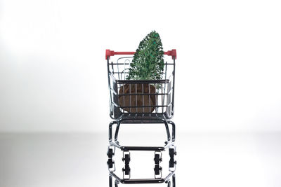 Close-up of wicker basket against white background