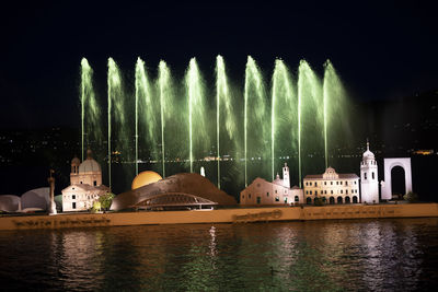 View of illuminated buildings at waterfront