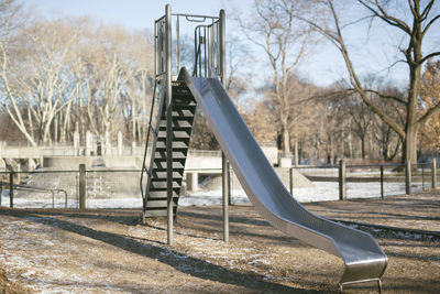 Playground in park against sky