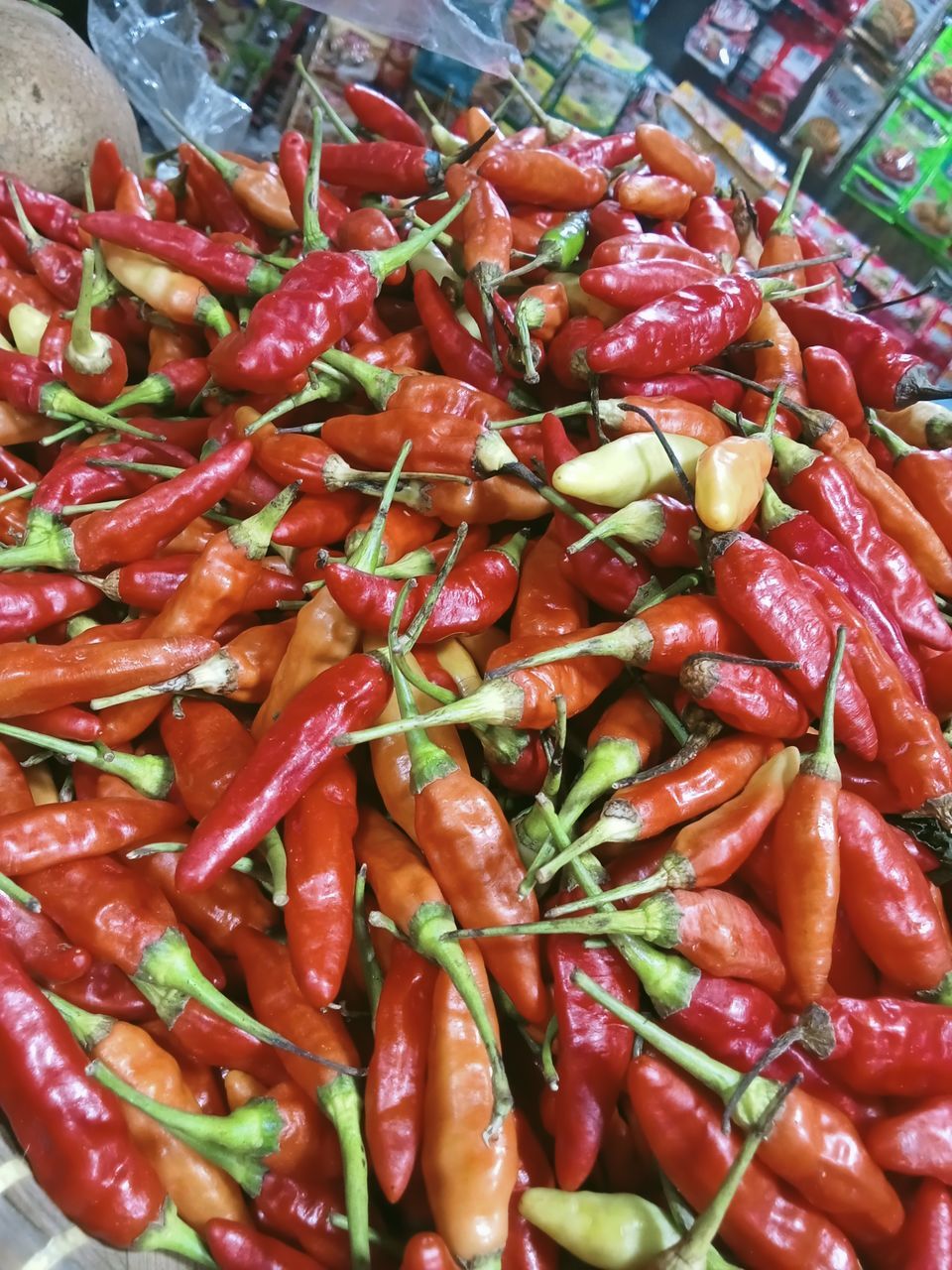 food and drink, food, freshness, vegetable, chili pepper, produce, large group of objects, red, healthy eating, abundance, wellbeing, market, high angle view, no people, for sale, bell peppers and chili peppers, dish, retail, plant, still life, pepper, spice, business, close-up, day, market stall, red chili pepper