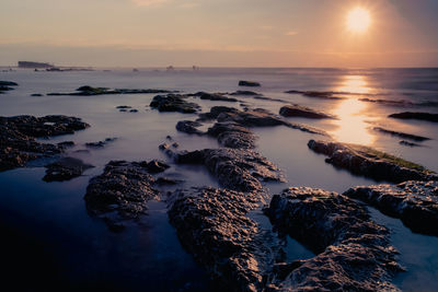 Scenic view of sea against sky during sunset