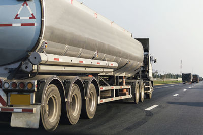 Vehicles on road against the sky