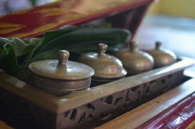 Close-up of old tea cup on table