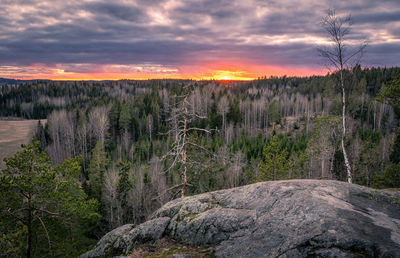 Scenic view of land against sky during sunset