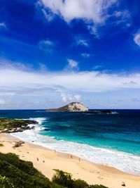 Scenic view of sea against blue sky