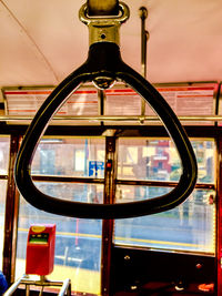 Close-up of electric lamp against window