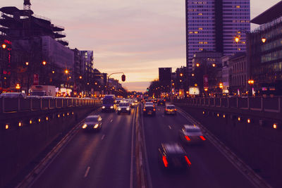 Cars on city street at night