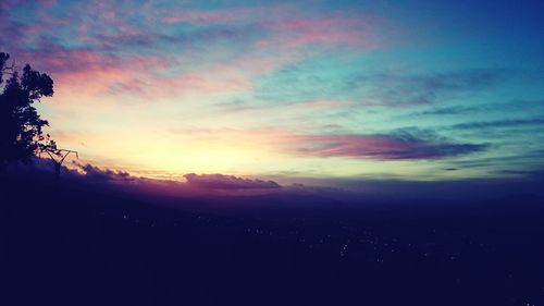 Scenic view of landscape against cloudy sky