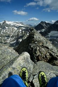 Low section of man standing on rock