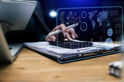 Man using mobile phone on table