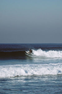 Man surfing on sea