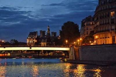 Illuminated city at waterfront