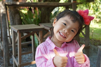 Portrait of cute girl smiling outdoors