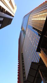 Low angle view of skyscrapers against clear sky