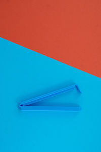 High angle view of colored pencils against blue background