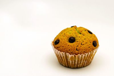 Close-up of cake against white background