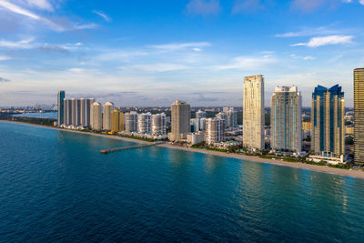 City by sea against sky