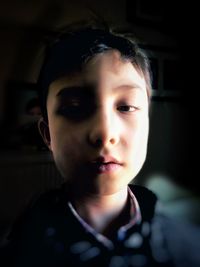 Close-up portrait of boy at home