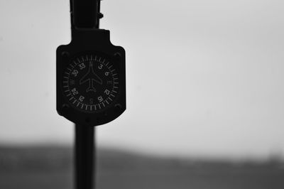 Close-up of clock on wall