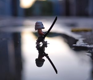 Close-up of toy in puddle