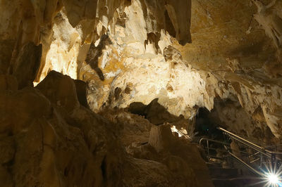 Low angle view of illuminated cave