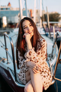 Beautiful young woman sitting in car