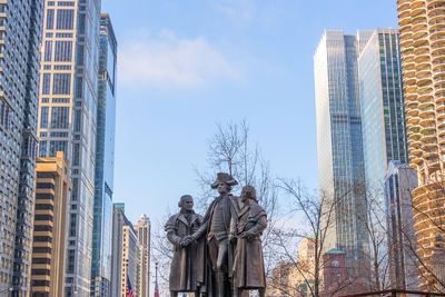 Heald square monument amidst buildings against sky