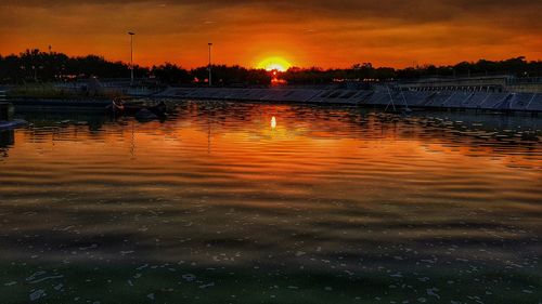 Scenic view of lake against sky during sunset