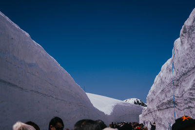 Rear view of man standing on mountain