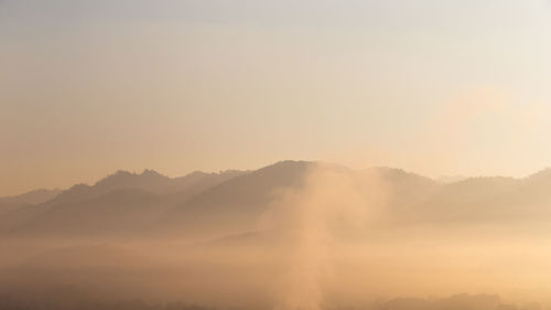 Scenic view of mountains against sky during sunset