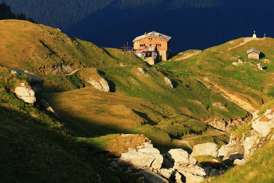 High angle view of chalets on green mountain at bucegi natural park