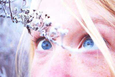 Close-up of young woman with blue eyes