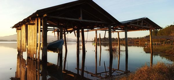 Pier on lake against sky