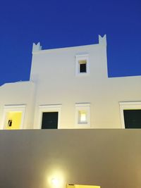 Low angle view of building against clear blue sky