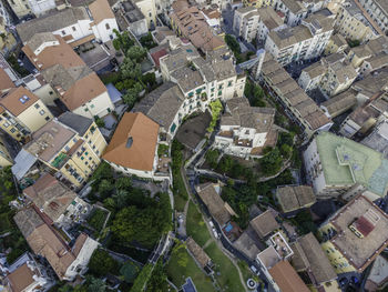 High angle view of street amidst buildings in town