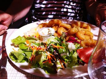 Close-up of person holding food on table