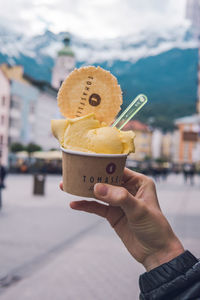 Hand holding ice cream cone