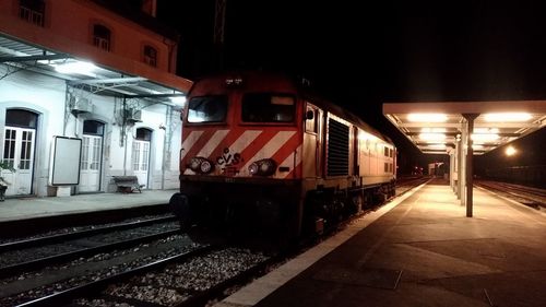 Train at railroad station at night